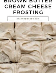 Speckled brown butter cream cheese frosting swirled on top of a cake with the words, "brown butter cream cheese frosting" written in black text above the photo.