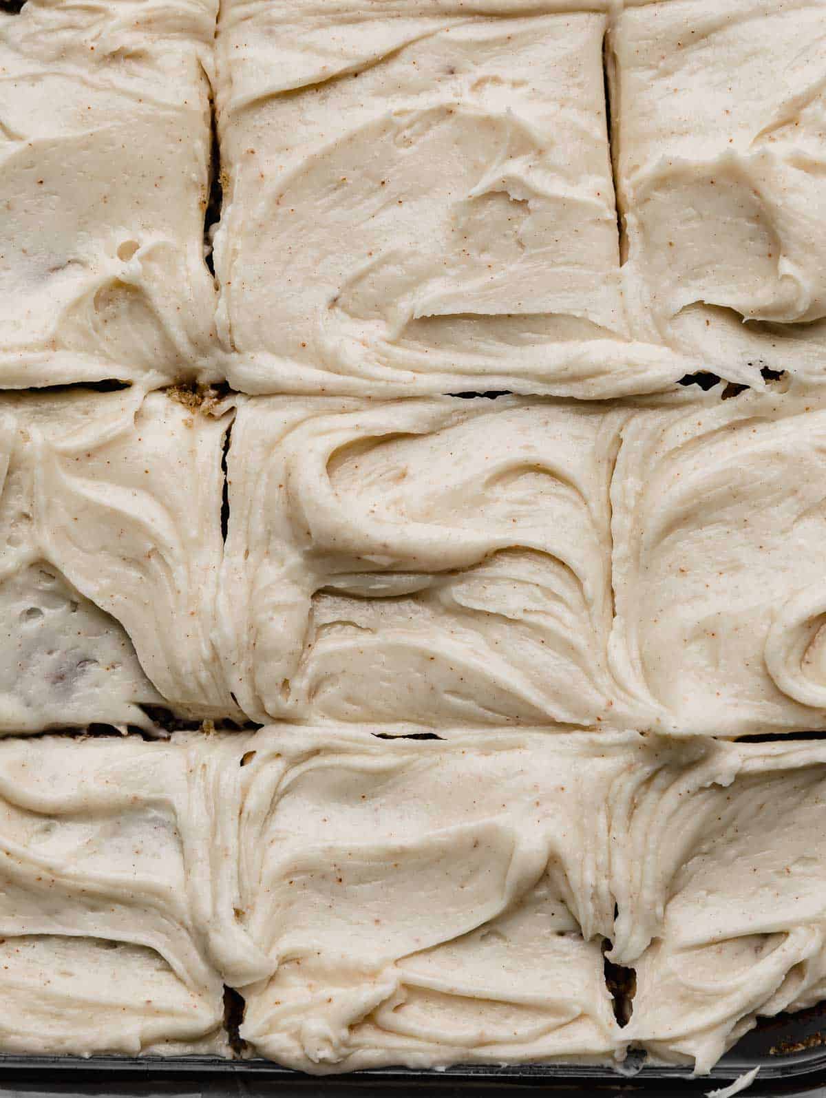 Swirled Brown Butter Cream Cheese Frosting with small brown specks throughout the frosting.