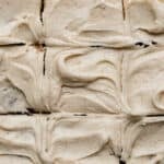 Swirled Brown Butter Cream Cheese Frosting with small brown specks throughout the frosting.