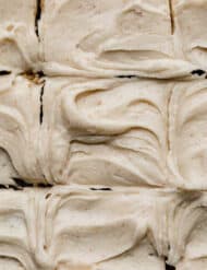 Swirled Brown Butter Cream Cheese Frosting with small brown specks throughout the frosting.