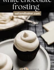 White chocolate buttercream frosting swirled on top of a black cupcake with the words, "white chocolate frosting" written in white text above the photo.