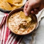 Cream Cheese Rotel and Sausage Dip in a brown bowl.