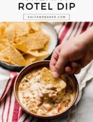 Cream Cheese Sausage Rotel Dip in a brown bowl on a white surface with the words, "Creamy Rotel Dip" written in black text above the photo.